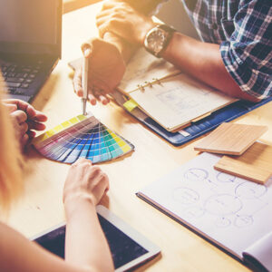 An image of people selecting colors and textures for their product, representing the 'Successful MVP for Your Tech Startup' Article